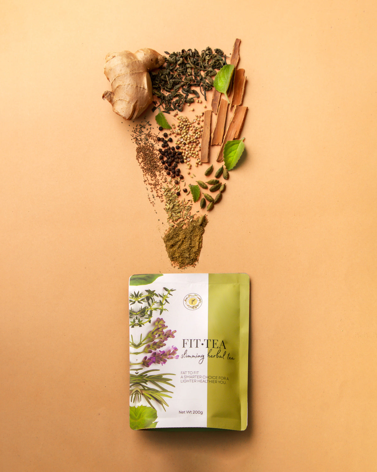 Raw herbal ingredients including ginger, cinnamon and cloves used in Fit Tea Slimming Herbal Tea
